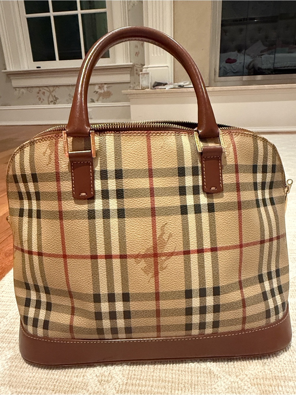 Burberry haymarket nova tote. Authentic plaid w brown handles strap and bottom.